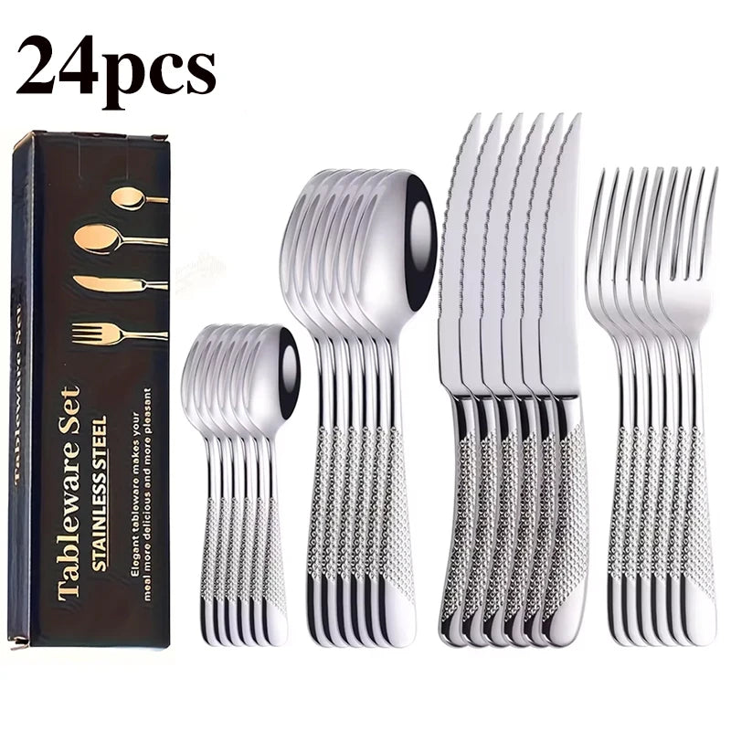 24-piece tableware set with silver cutlery and packaging on a white background