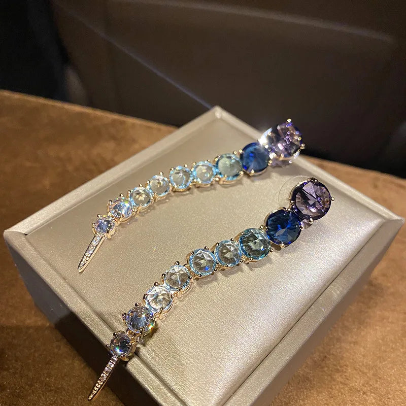A row of large round diamond zircon earrings and women's colored diamonds