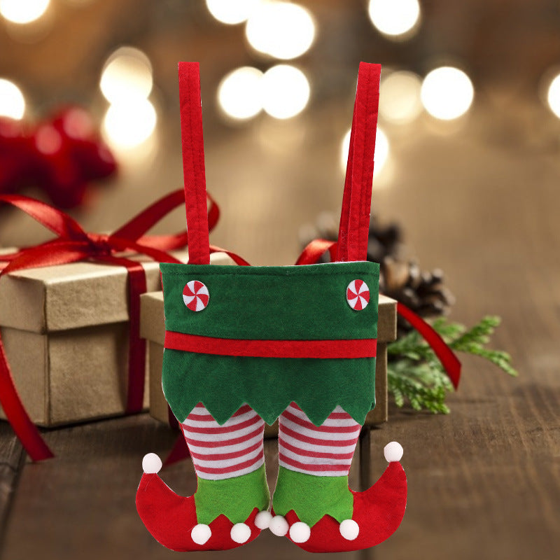 Elf Christmas gift bag featuring a whimsical green elf outfit with red-and-white striped legs and curled elf shoes, perfect for holiday gift wrapping, Christmas candy, party favors, festive home décor, and reusable seasonal gift presentation.