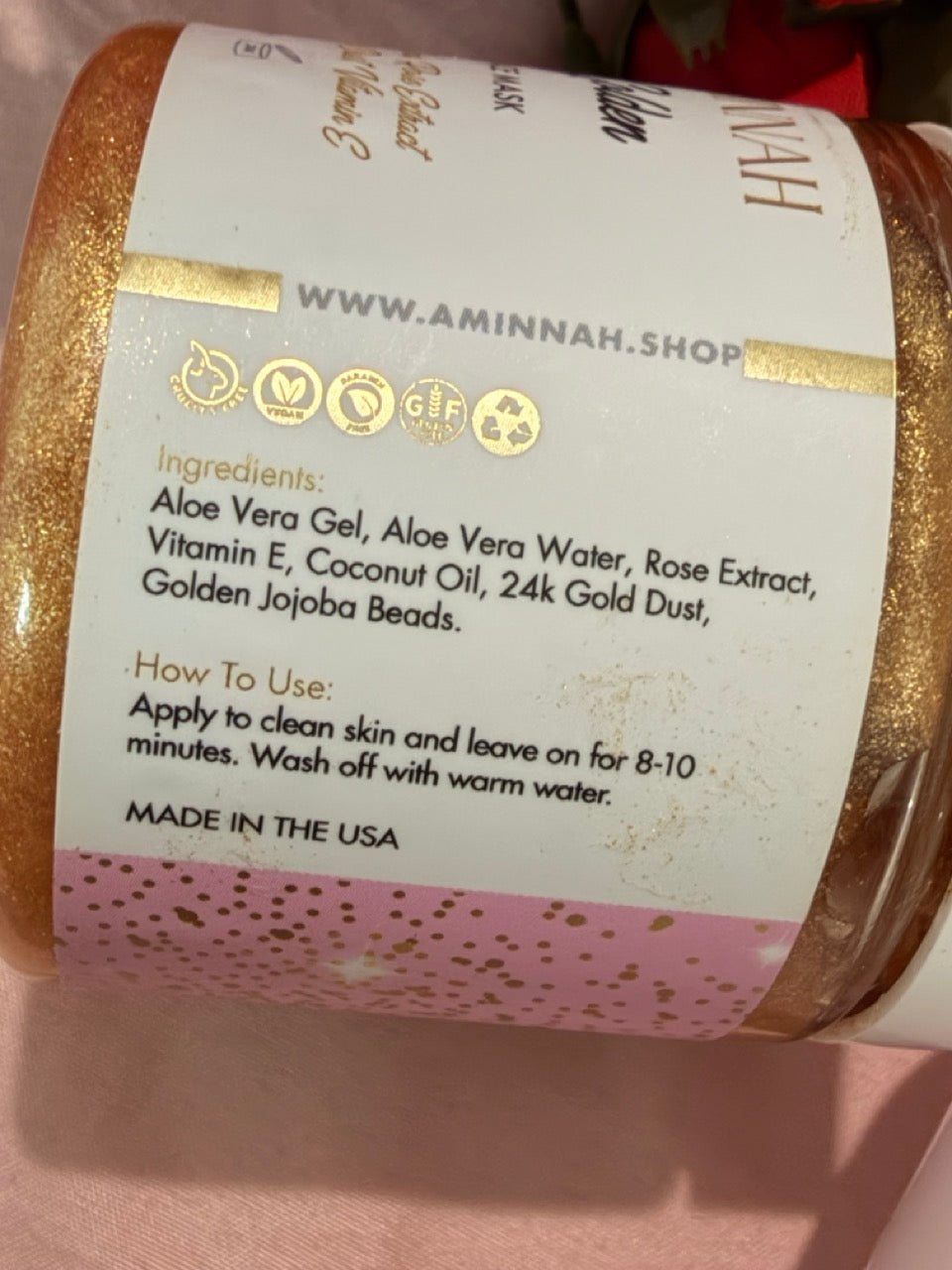24K Gold Jelly Face Mask back label with ingredients and directions, hydrating aloe vera, rose extract, vitamin E, jojoba beads, natural ingredients, vegan skincare, clean beauty, cruelty free, paraben free, gluten free, recyclable packaging, female owned brand, made in USA, luxury facial skincare product.