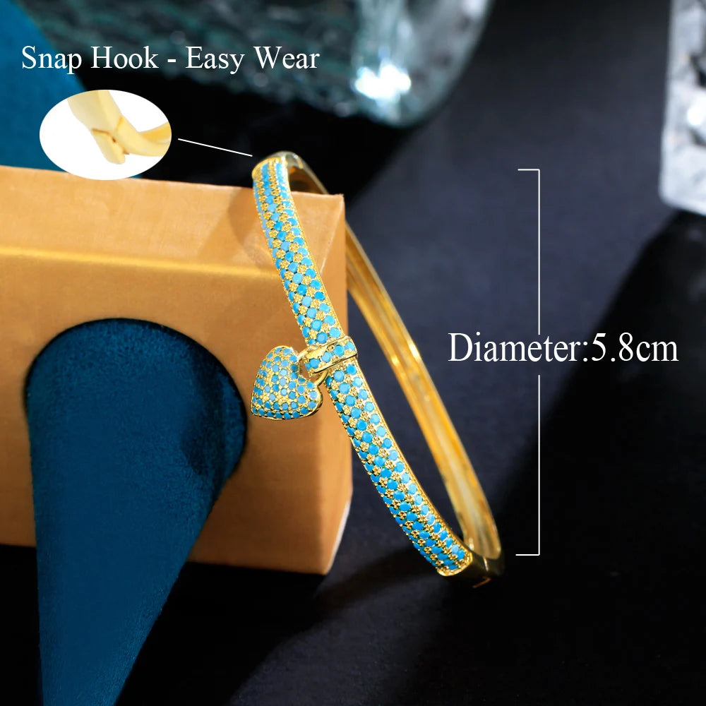 ThreeGraces Elegant Light Blue Cubic Zirconia Gold Color Small Heart Charm Luxury Open Cuff Bangle for Women Party Jewelry B080