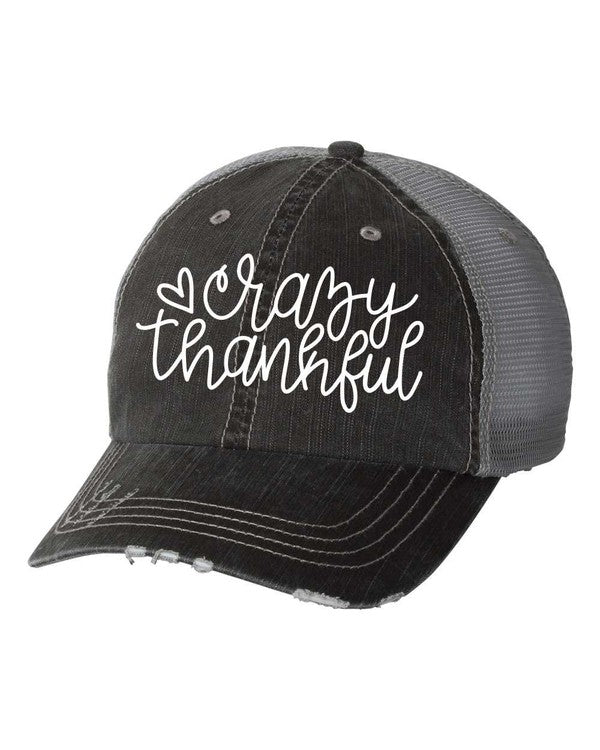 Black vintage distressed mesh trucker hat with white "Crazy Thankful" embroidered script, curved distressed brim, contrast stitching, breathable mesh back, and adjustable snapback closure on a white background. Vintage Distressed "Crazy Thankful" Embroidered Trucker Hat – Adjustable Unisex Mesh Baseball Cap for Thanksgiving, Fall & Everyday Wear