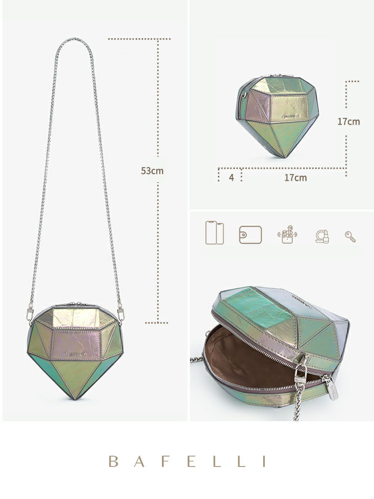 Diamond-shaped iridescent leather crossbody bag with a silver chain strap, zip-top closure, geometric faceted design, and compact interior. Approximate dimensions: 17 cm x 17 cm with a 53 cm shoulder drop. Perfect as a trendy mini messenger bag, evening purse, or statement accessory.