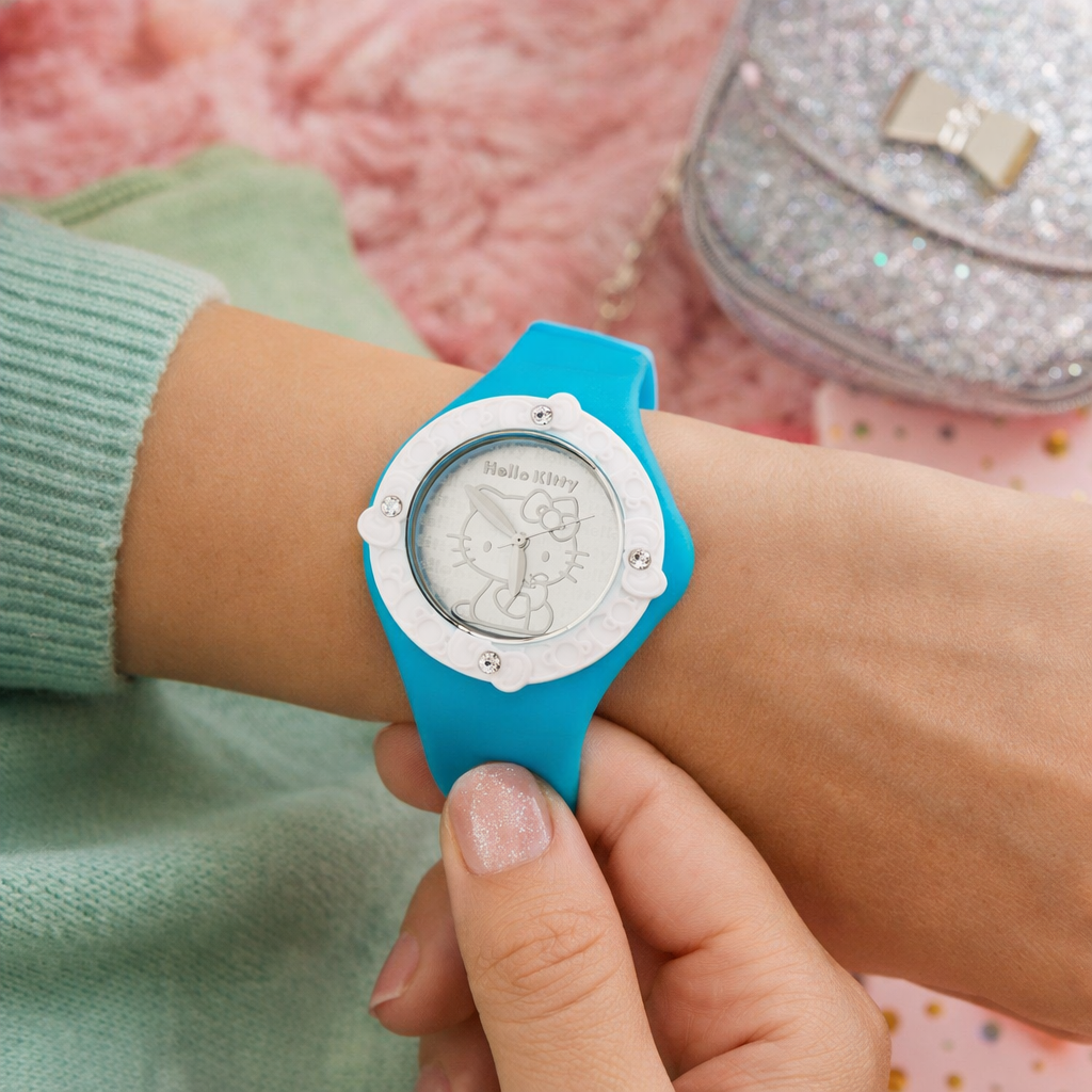 Person wearing a blue watch with a white face, held by a hand, with a pink textured background.