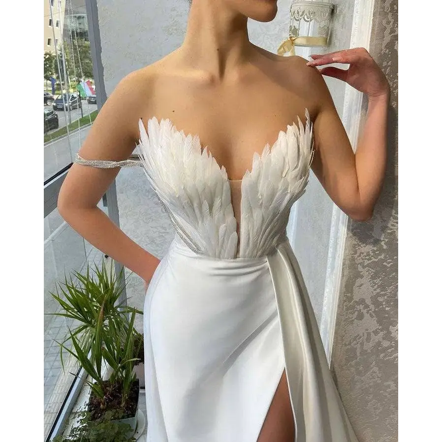 White Satin Gown with Feathers Sweeping the Floor