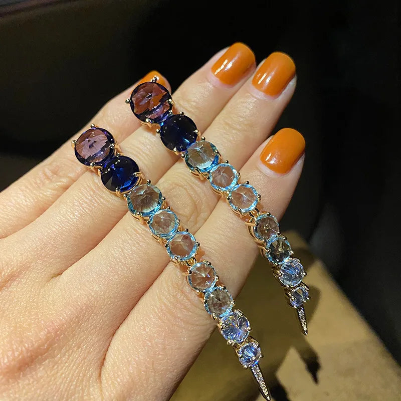 A row of large round diamond zircon earrings and women's colored diamonds