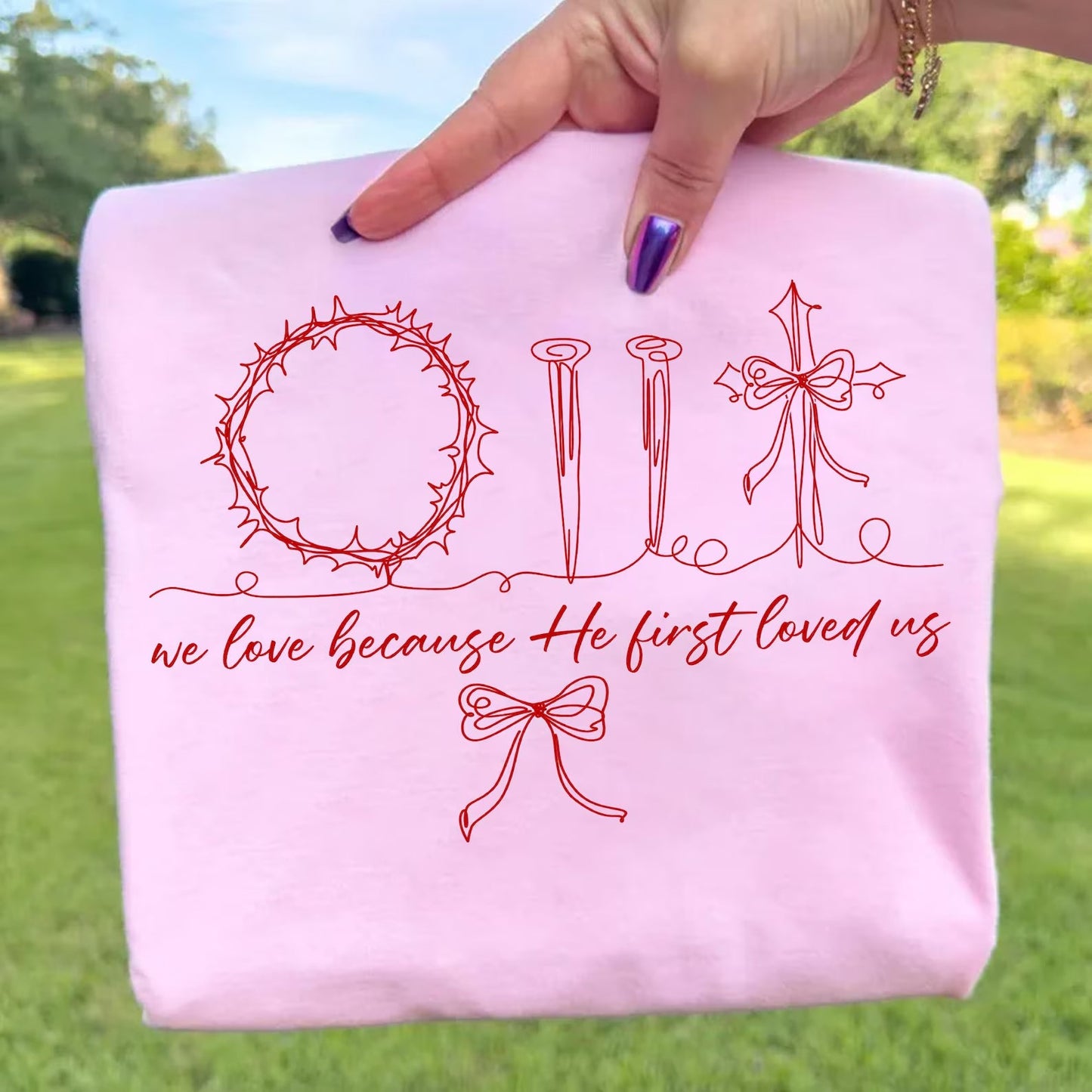 We Love Because He First Loved Us Graphic Tee
