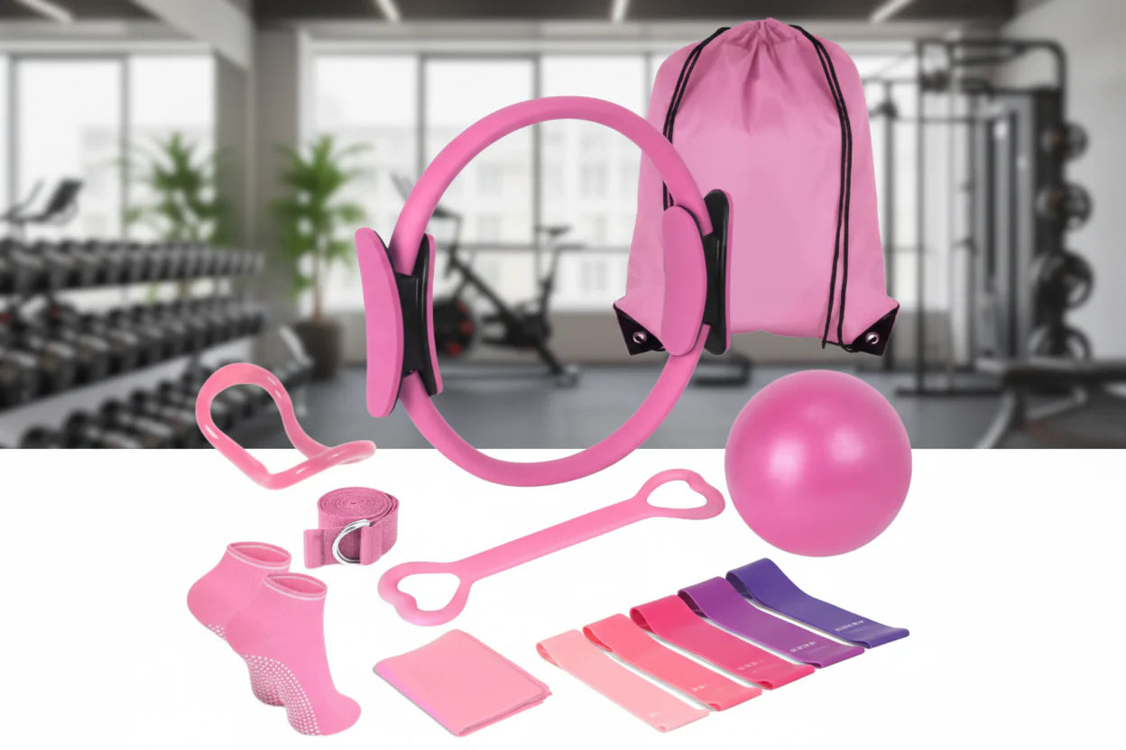 Pink fitness equipment set including resistance bands, ball, and backpack in a gym setting