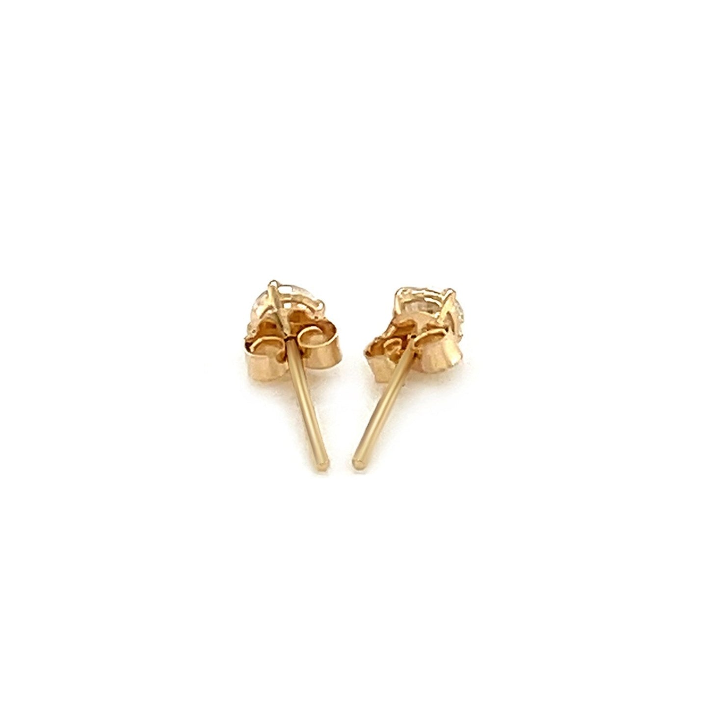 Gold bow-shaped earrings on a white background