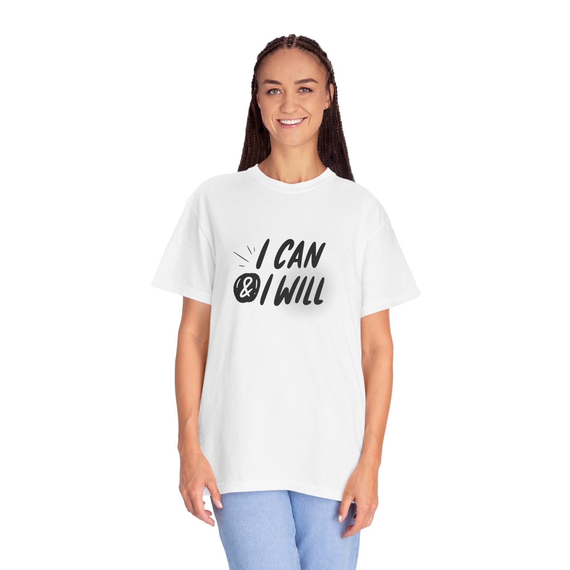 A woman modeling a white short-sleeve graphic T-shirt with the text 'I CAN & I WILL' printed in black across the chest, paired with light blue jeans against a plain white background.