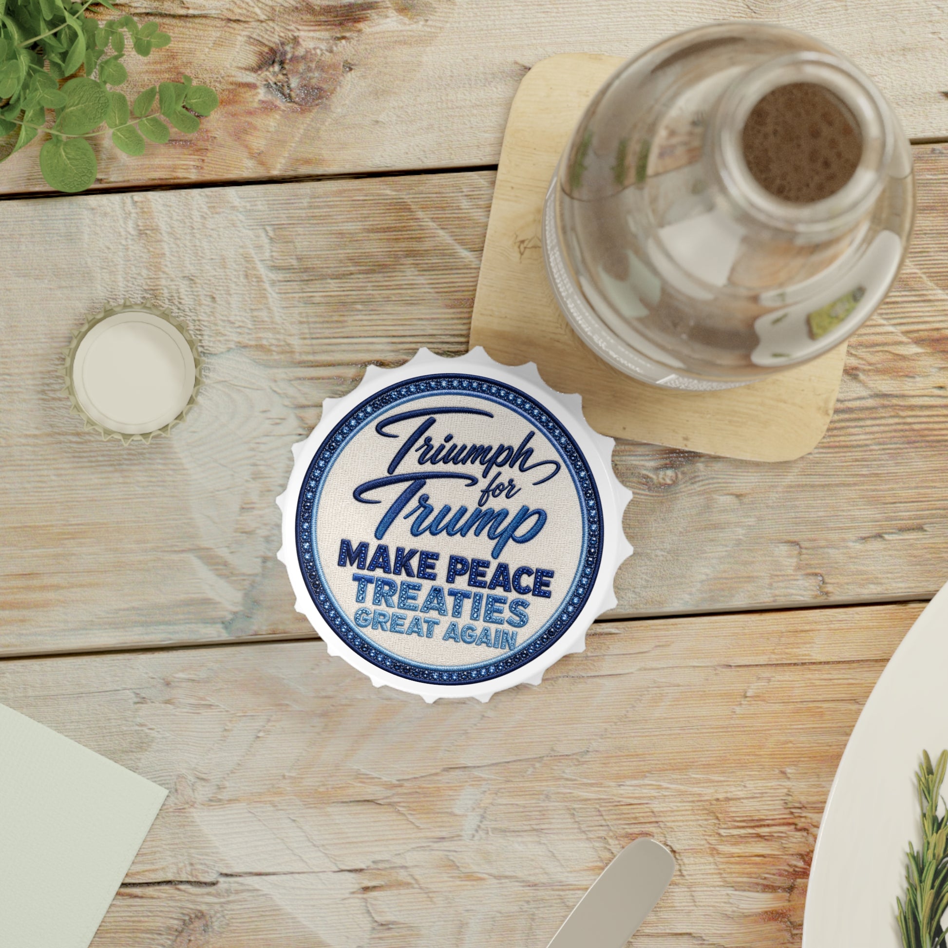 Bottle cap with 'Triumph for Trump' text on a wooden table with a glass and bottle. Magnetic bottle opener featuring a vintage embroidered-style "Triumph for Trump – Make Peace Treaties Great Again" graphic attached to a stainless steel refrigerator.