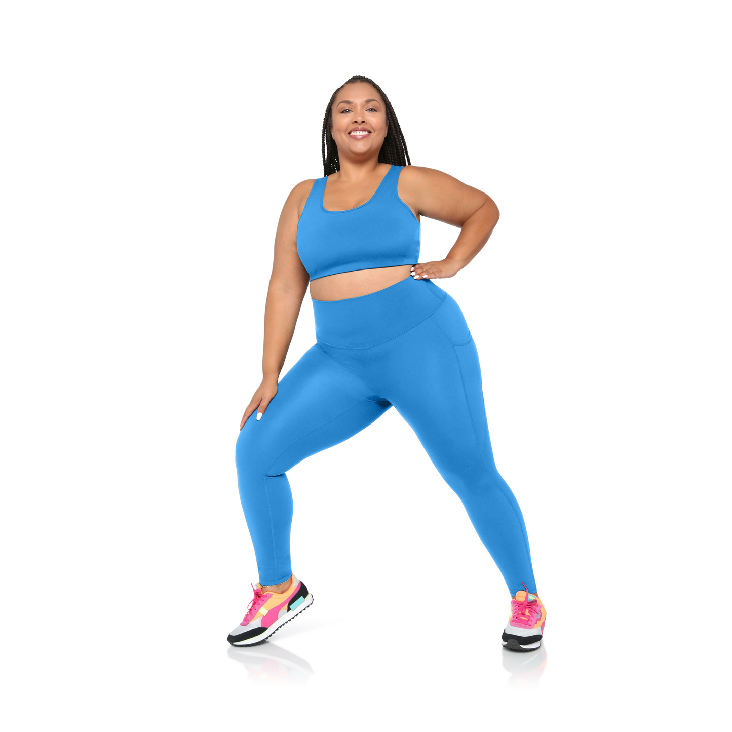plus size Woman wearing a blue athletic outfit on a white background