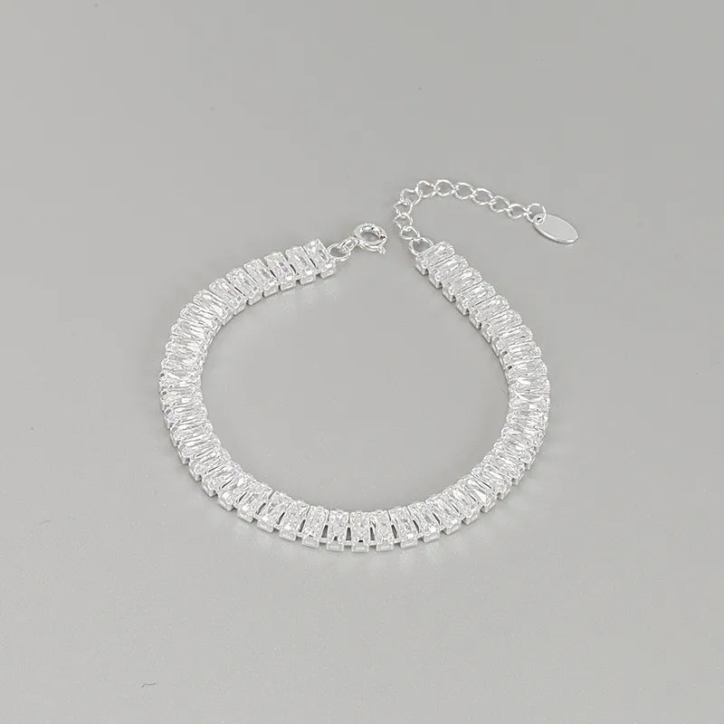 Silver bracelet with clear gemstones on a gray background. 1 Piece 925 Sterling Silver Geometric 925 sterling silver box chain Bracelets
