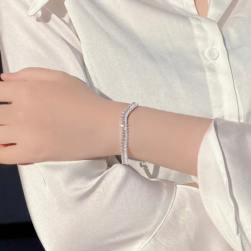 Silver bracelet on a person's wrist with a white shirt background. 1 Piece 925 Sterling Silver Geometric 925 sterling silver box chain Bracelets