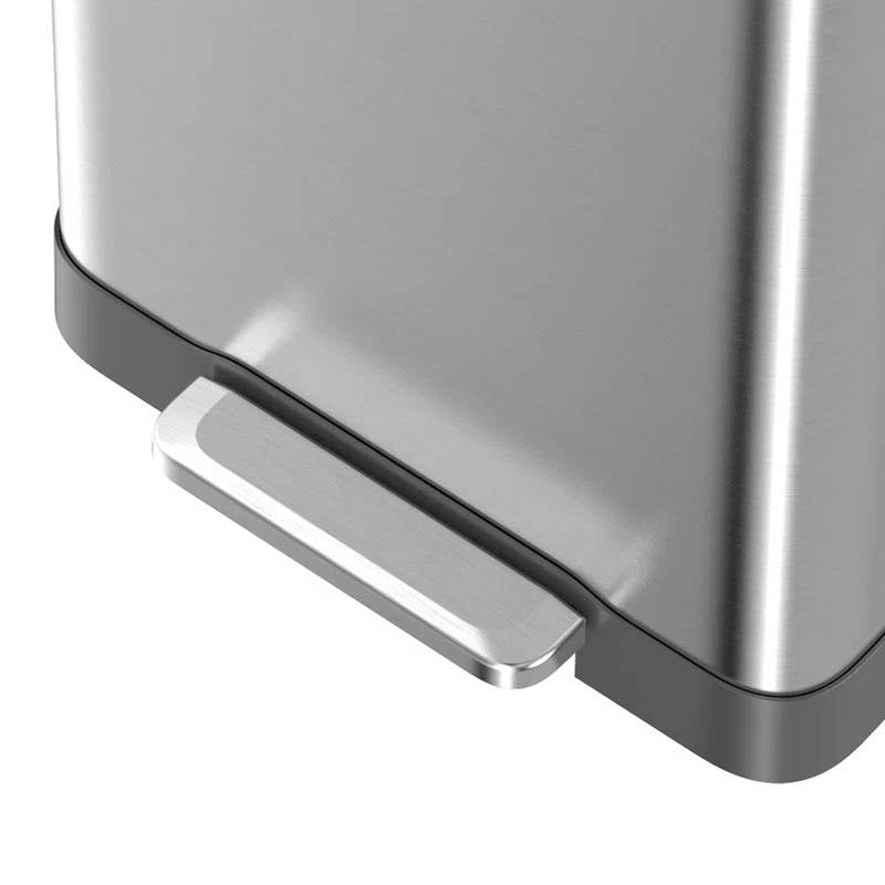 Close-up of a metallic trash bin with a white background