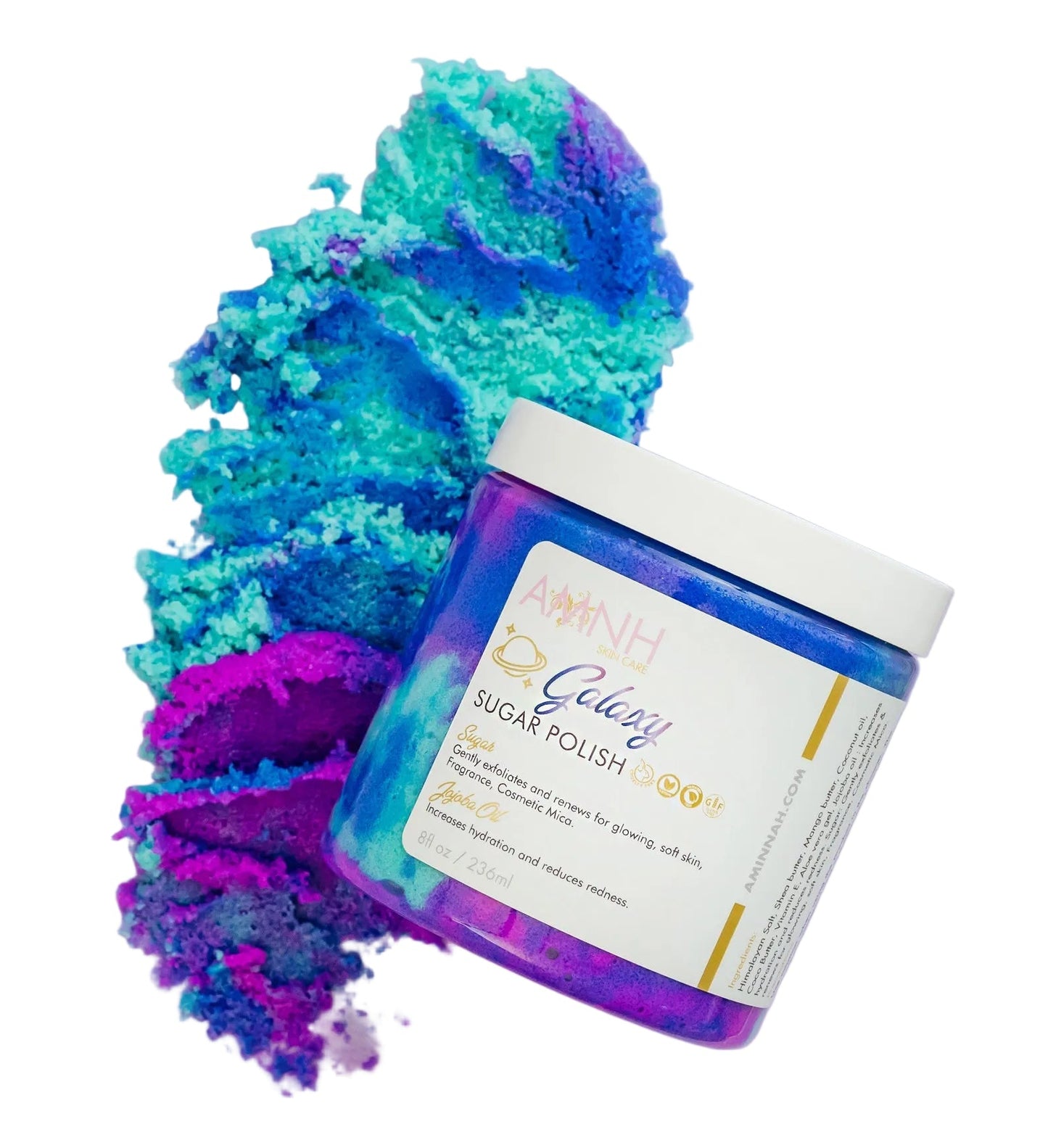 Jar of 'Galaxy Sugar Polish' with colorful powder on a white background. Galaxy teal, purple and blue organic sugar scrub with only natural ingredients. Gentle exfoliator clean beauty.