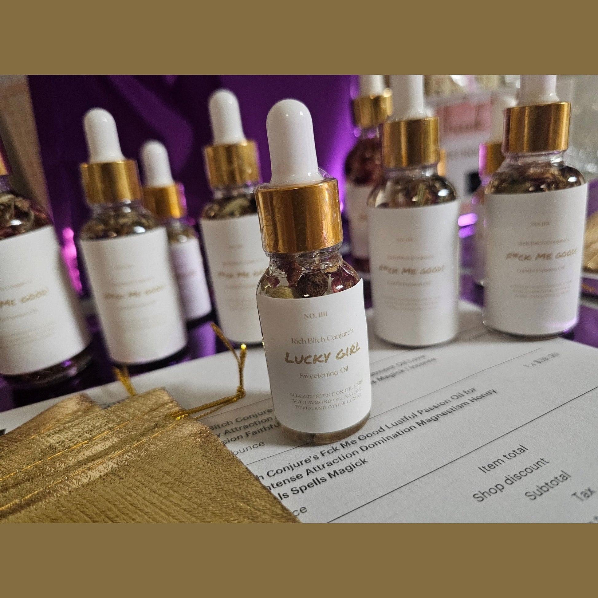 Bottle of 'Lucky Girl' oil with dropper on a receipt with blurred background. Lucky Girl Sweetening Hoodoo Conjure Oil | Good Luck Oil | Favor and Opportunity Oil | Prosperity Ritual Oil | Rootwork Spiritual Supply