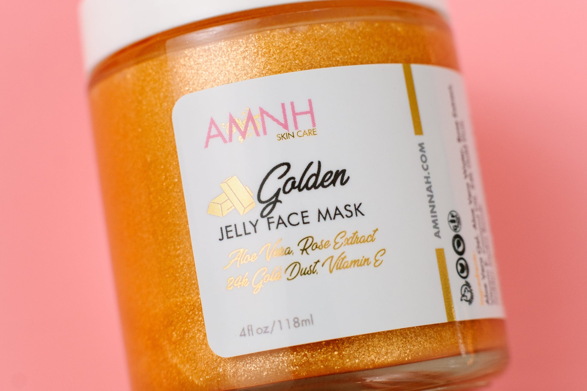 AMNH Golden Jelly Face Mask jar on a pink background. 24K Gold Jelly Face Mask – Hydrating Aloe Vera, Rose Extract & Vitamin E | Vegan Skincare