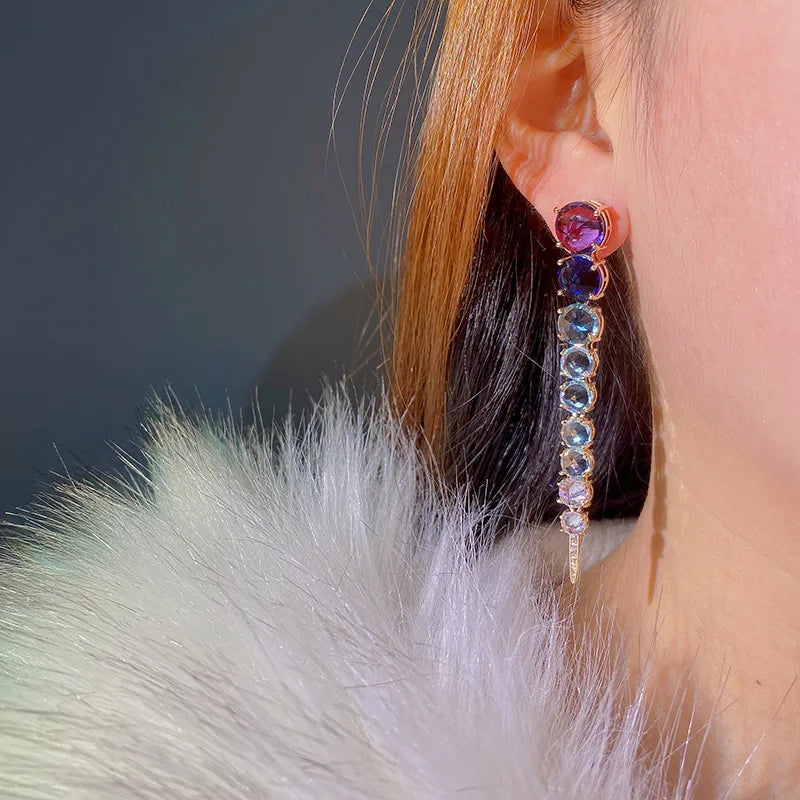 A row of large round diamond zircon earrings and women's colored diamonds