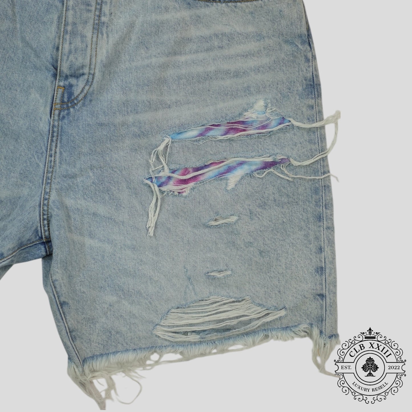 Amiri Tie Dye Thrasher Jean Shorts in Light Wash