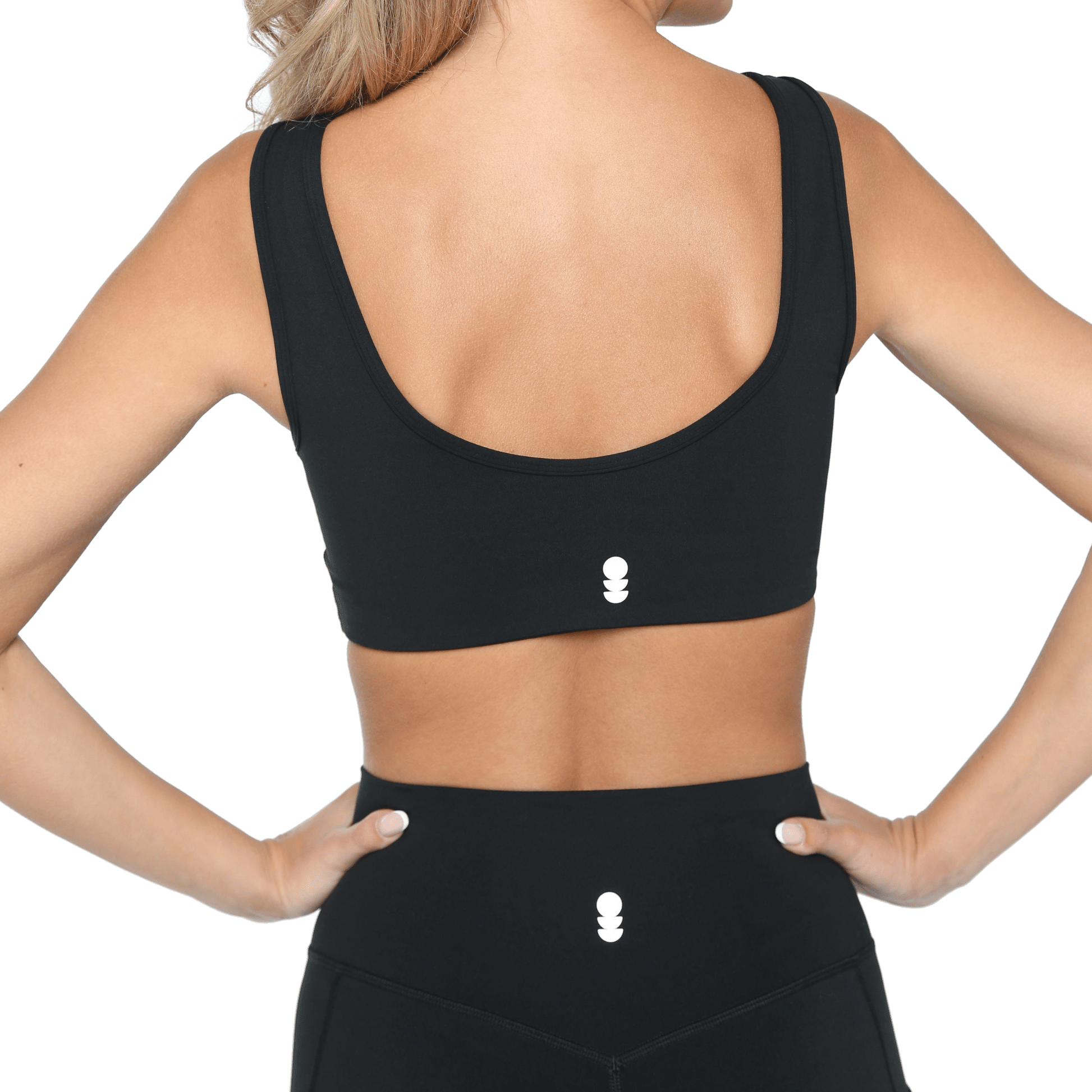 Black high-support sports bra and matching high-waisted leggings for women, back view, supportive athletic activewear workout set for gym, yoga, running and fitness on white background.
