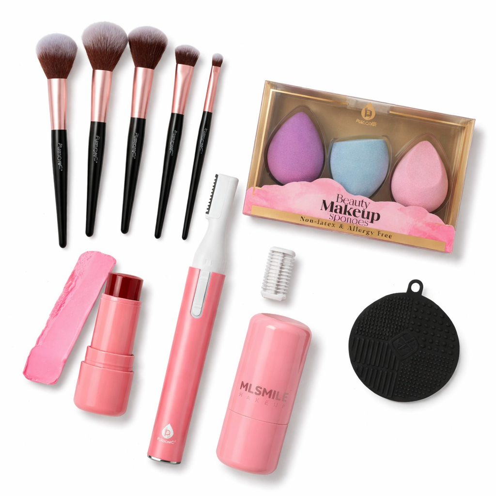 Makeup brushes, pink and white tool, beauty sponges, and black round tool on a white background