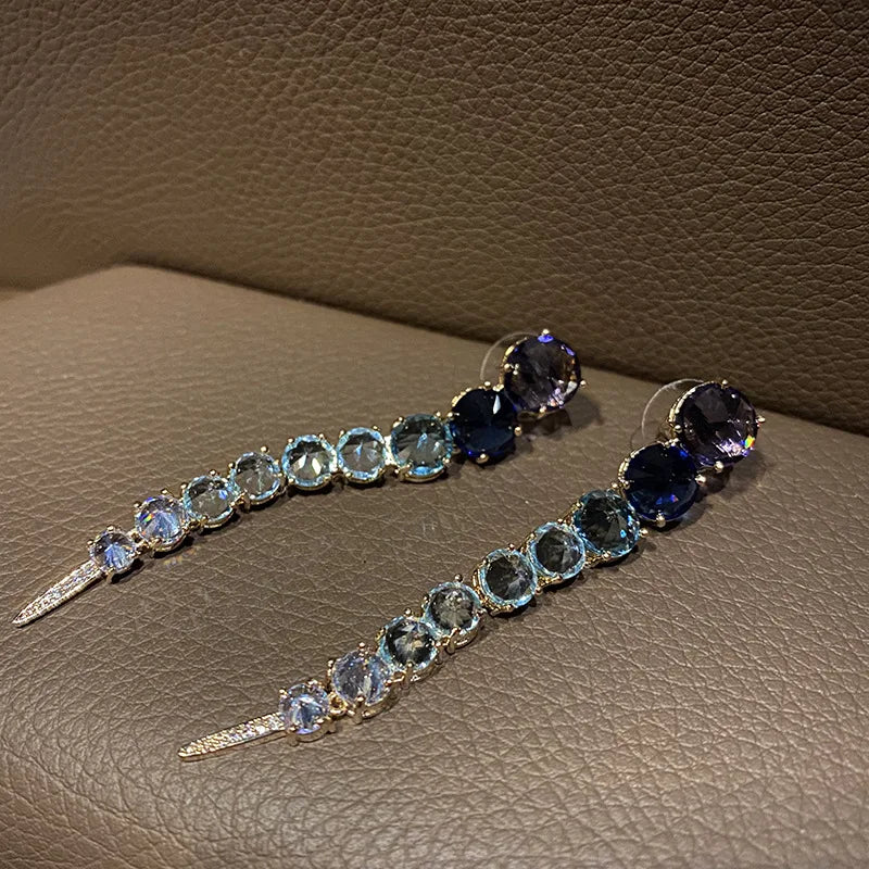 A row of large round diamond zircon earrings and women's colored diamonds