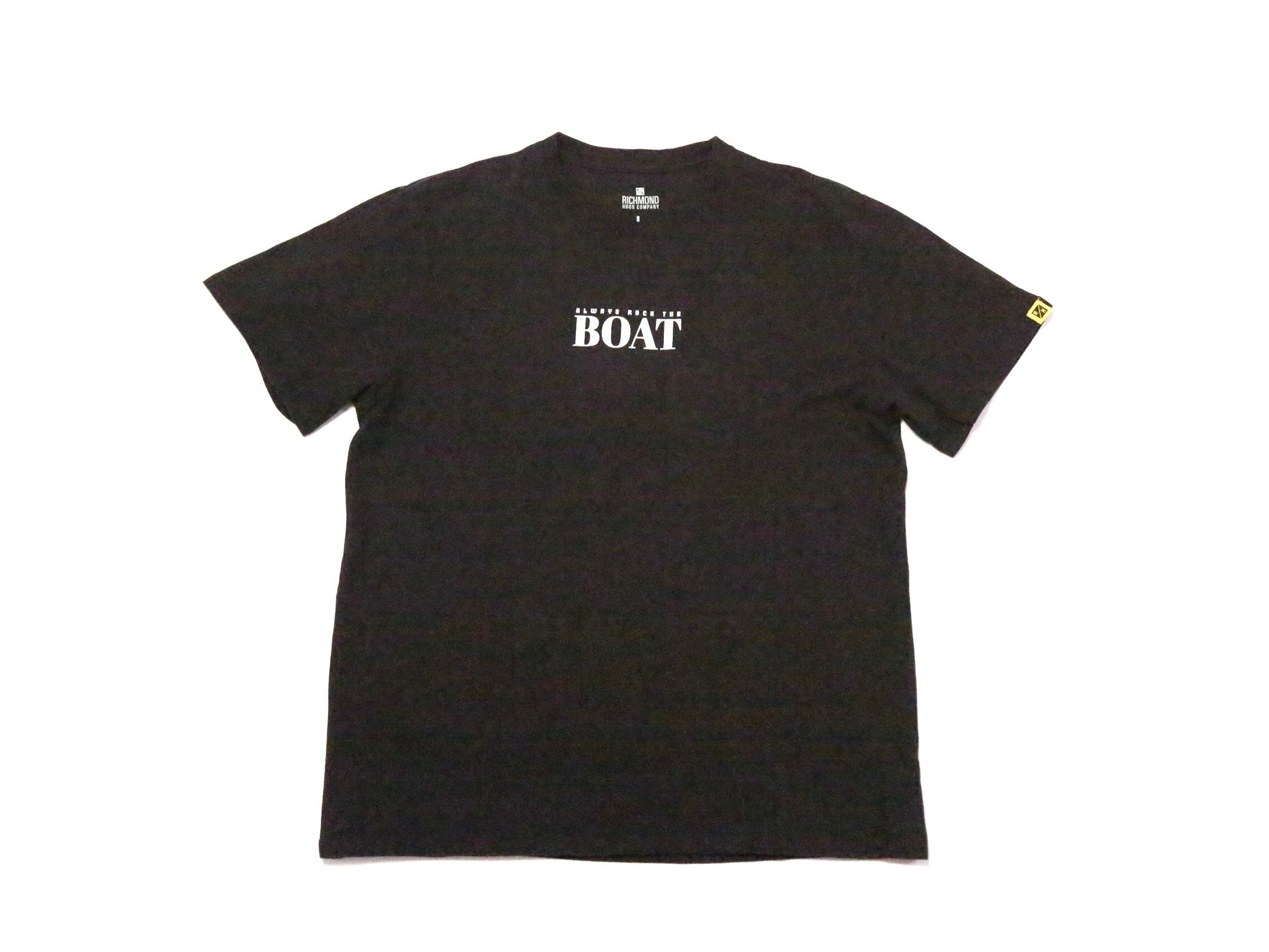 A black short-sleeve t-shirt with 'ALWAYS ROCK THE BOAT' printed in white across the chest, displayed flat against a plain white background.