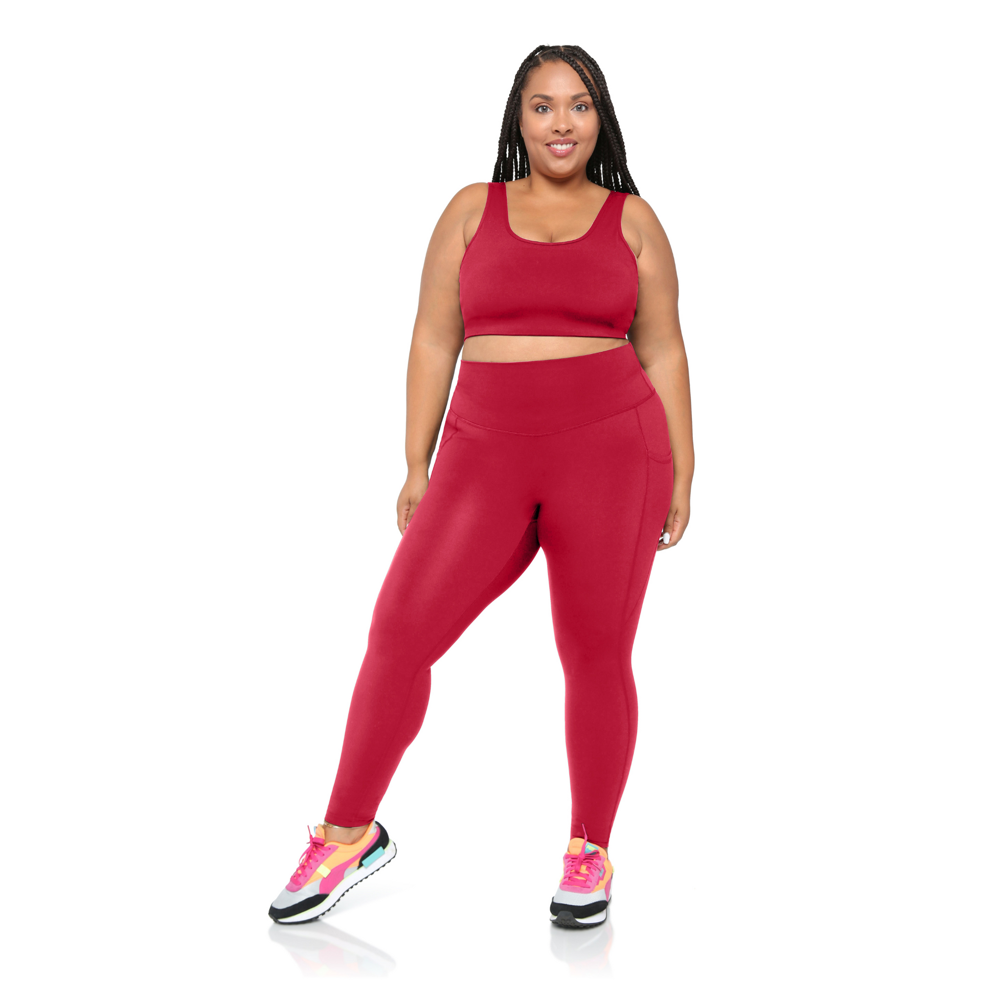 Plus size Woman wearing a red athletic outfit on a white background