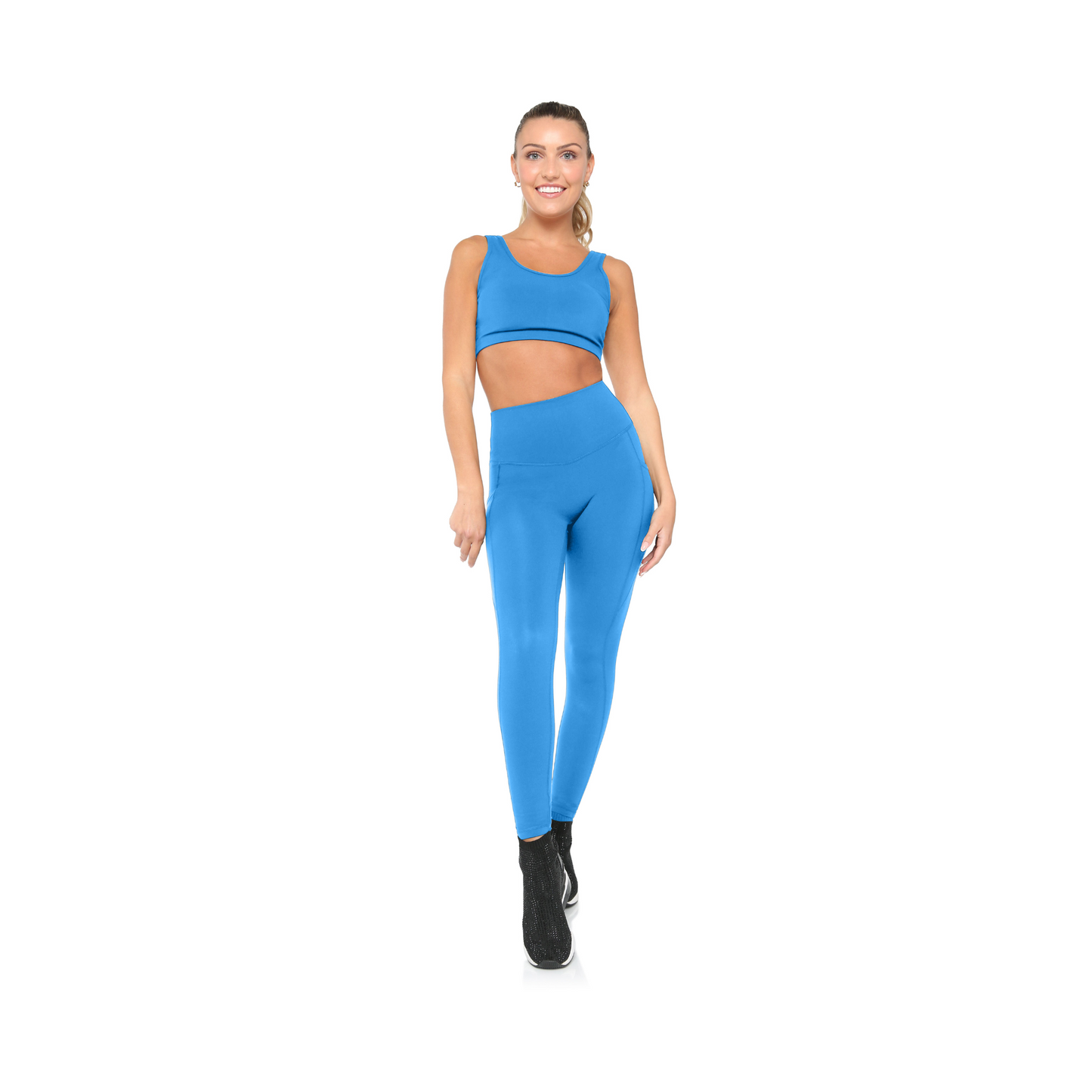 Woman wearing a blue athletic outfit on a white background