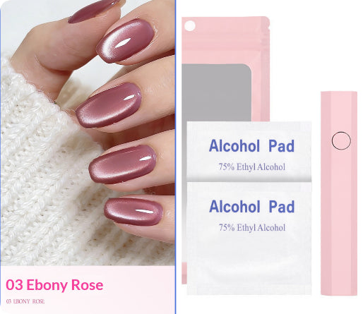 Nail polish color swatch showing a glossy dusty rose/mauve shade on fingernails, alongside product packaging and two alcohol pads labeled 'Alcohol Pad 75% Ethyl Alcohol'.