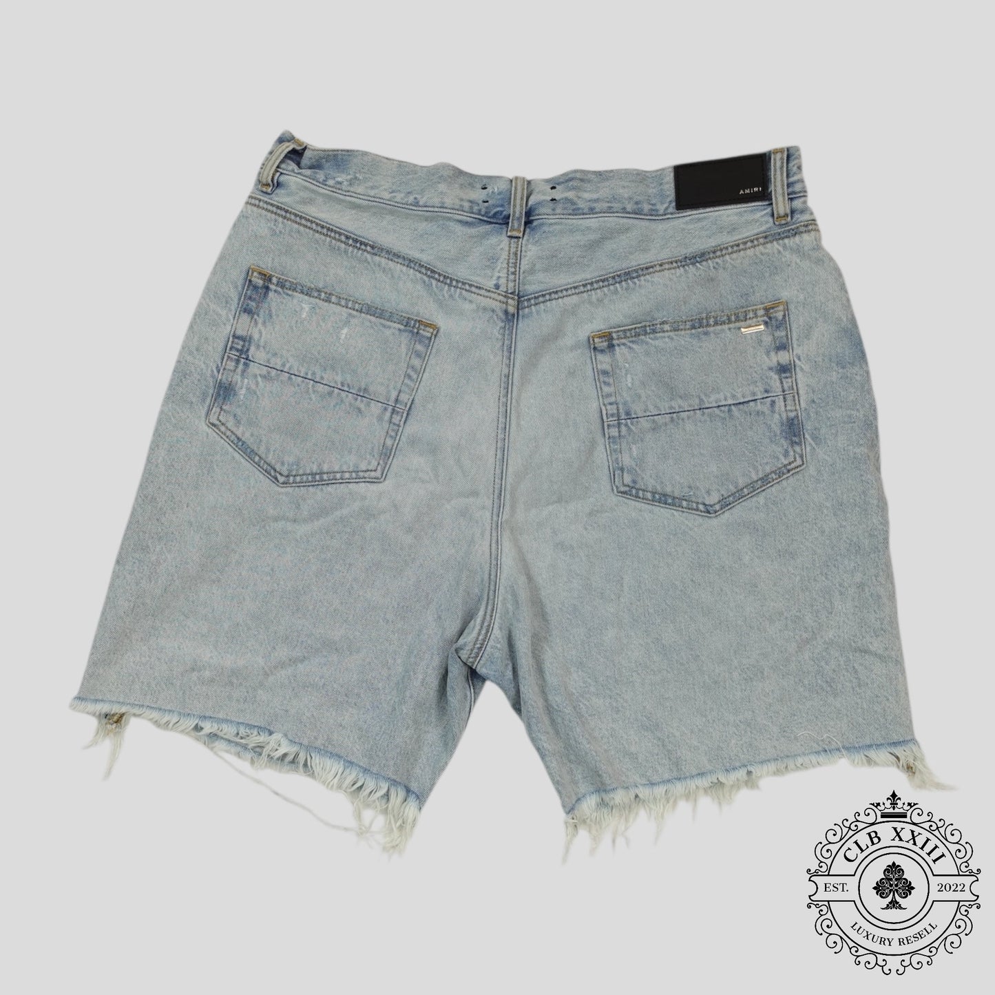 Amiri Tie Dye Thrasher Jean Shorts in Light Wash