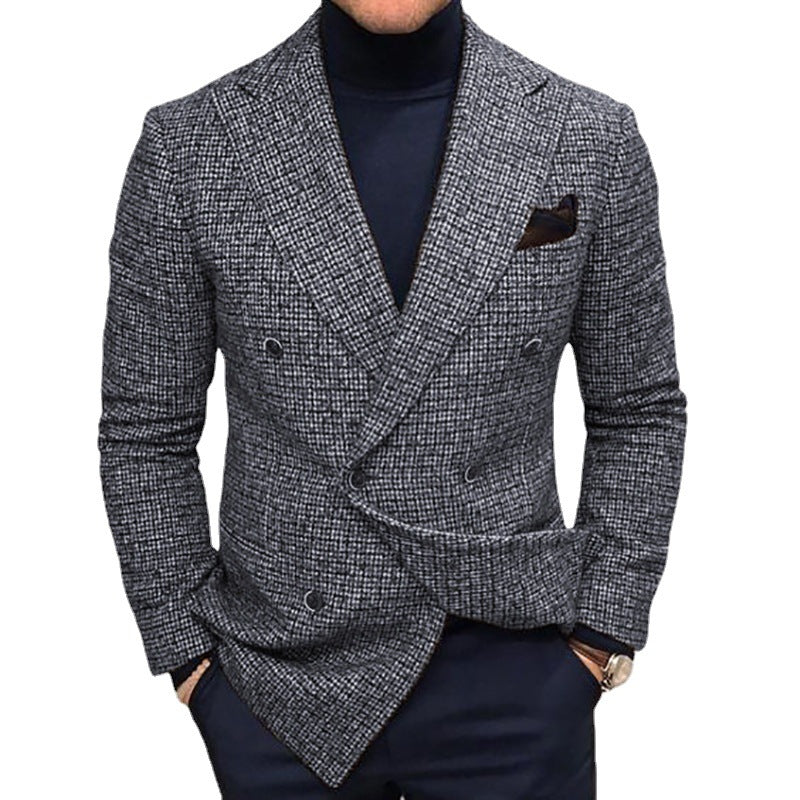 Gray checkered blazer worn by a person on a white background