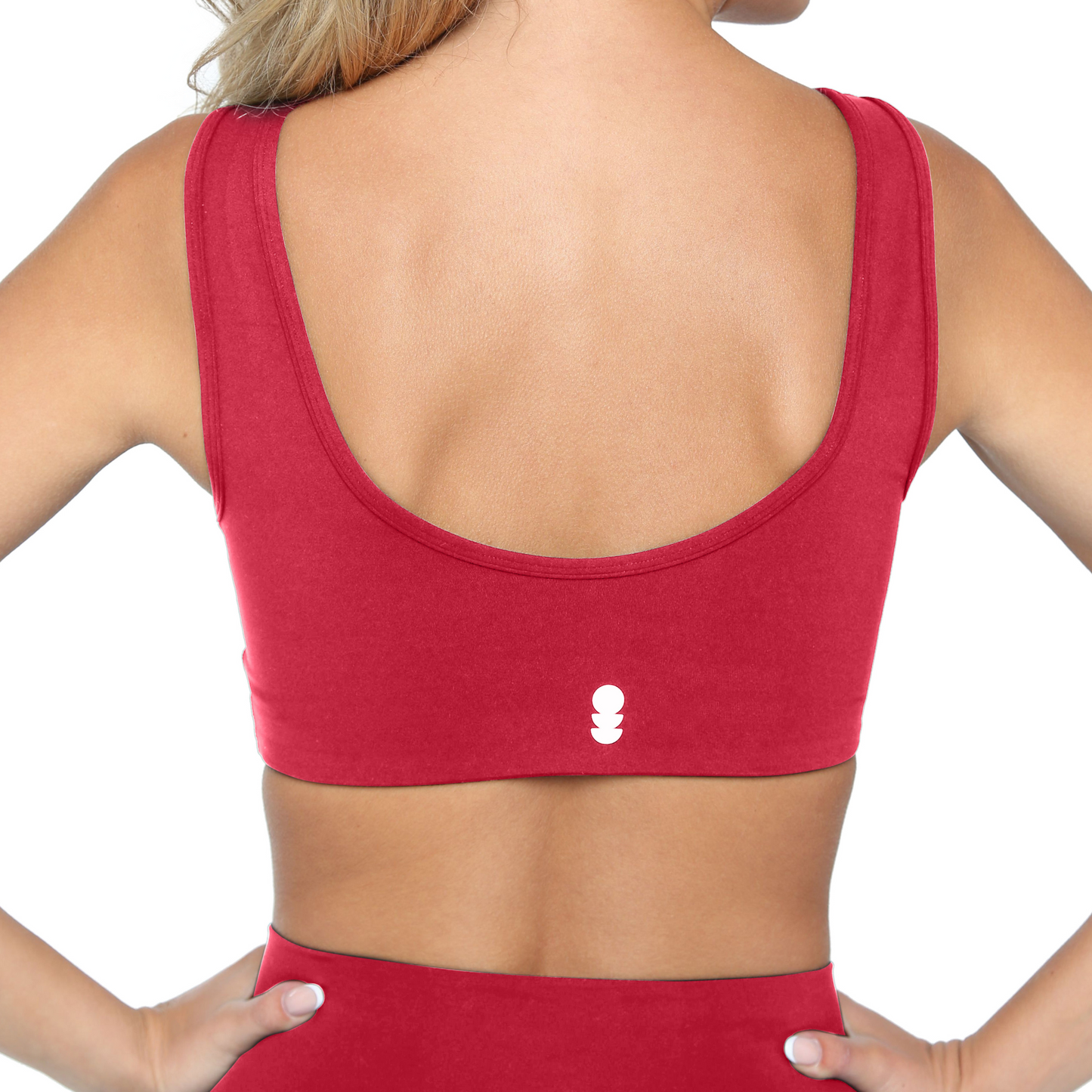 Red sports bra with a small logo on a white background