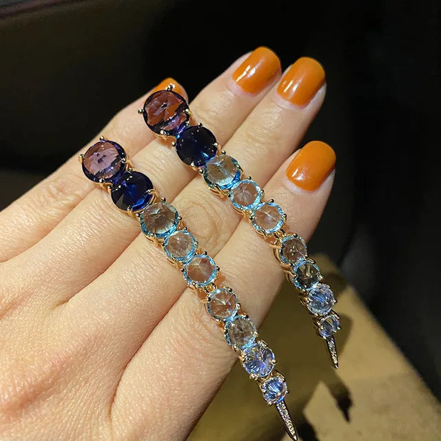 A row of large round diamond zircon earrings and women's colored diamonds