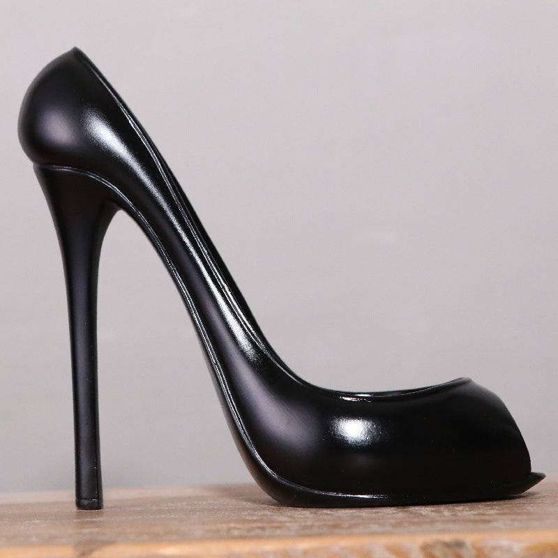 Modern high-heeled shoe-shaped wine rack made of synthetic resin, featuring a European-style minimalist design for home decor and wine bottle display.