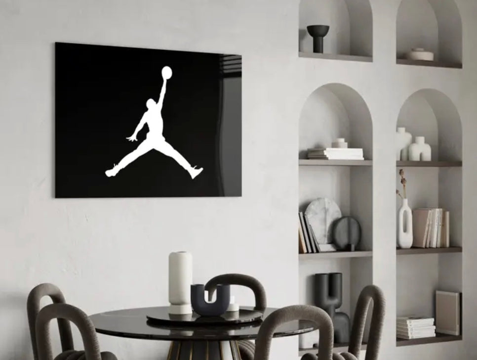 Dining room with a black and white logo on the wall above a table. Air_Jordan_Glass_Wall_Art_-_Premium_Quality_Art_Piece_Perfect_for_sneakerheads_basketball_fans_sports_rooms_man_caves_teen_lounges_and_modern_luxury_decor_Michael_Jordan_Michael_Jordan_Air_Jordan_Glass_Wall_Art_piece_decorative_collectors
