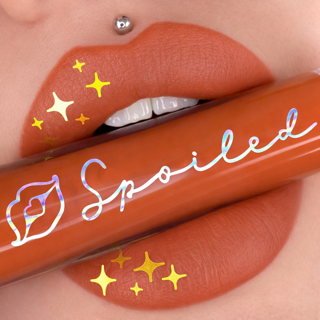 Lipstick with 'Spoiled' text on a close-up of lips Almond lips almond lipgloss almond color lips almond beauty cosmetics