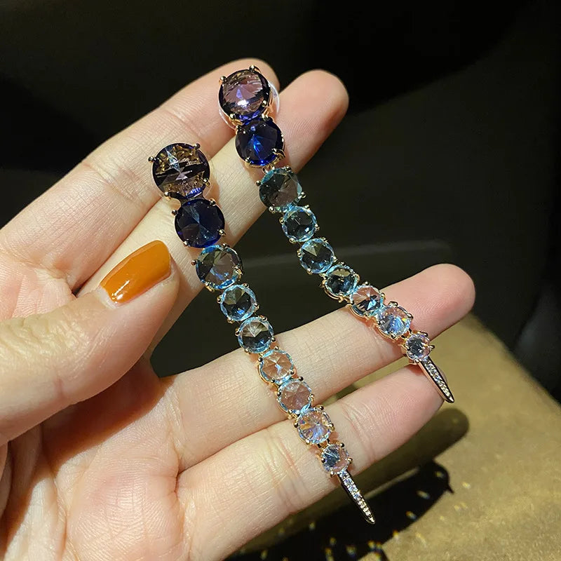 A row of large round diamond zircon earrings and women's colored diamonds