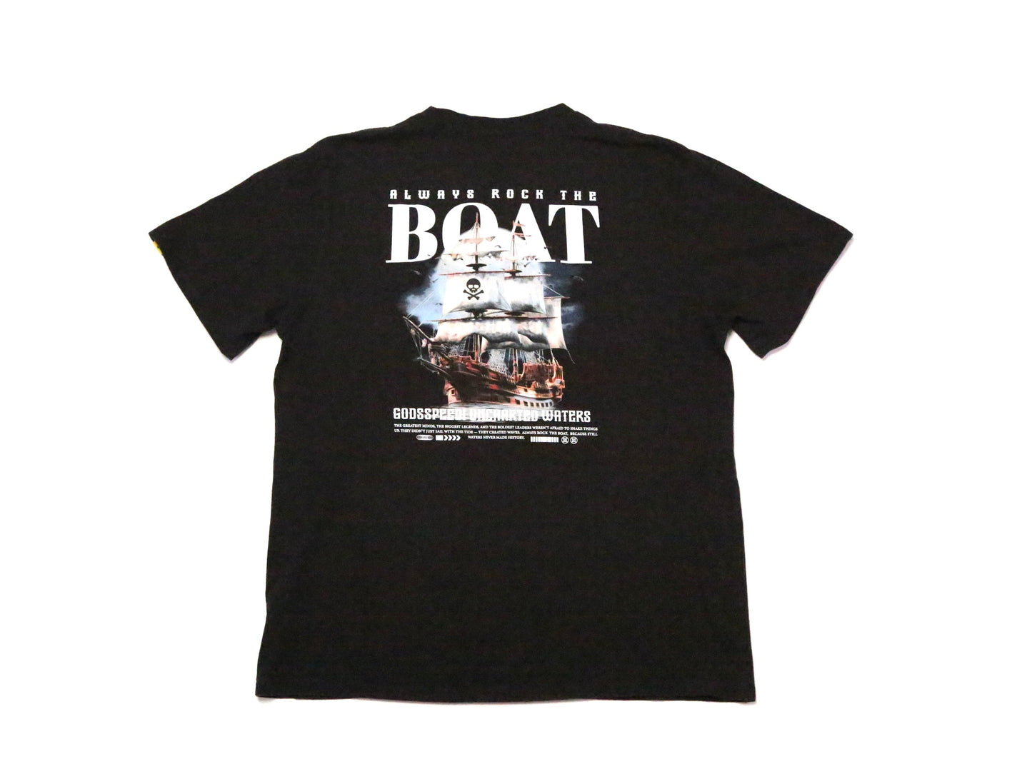 A black short-sleeve t-shirt with a large graphic print on the back, featuring the text 'ALWAYS ROCK THE BOAT' and a ship illustration, shown against a plain white background.