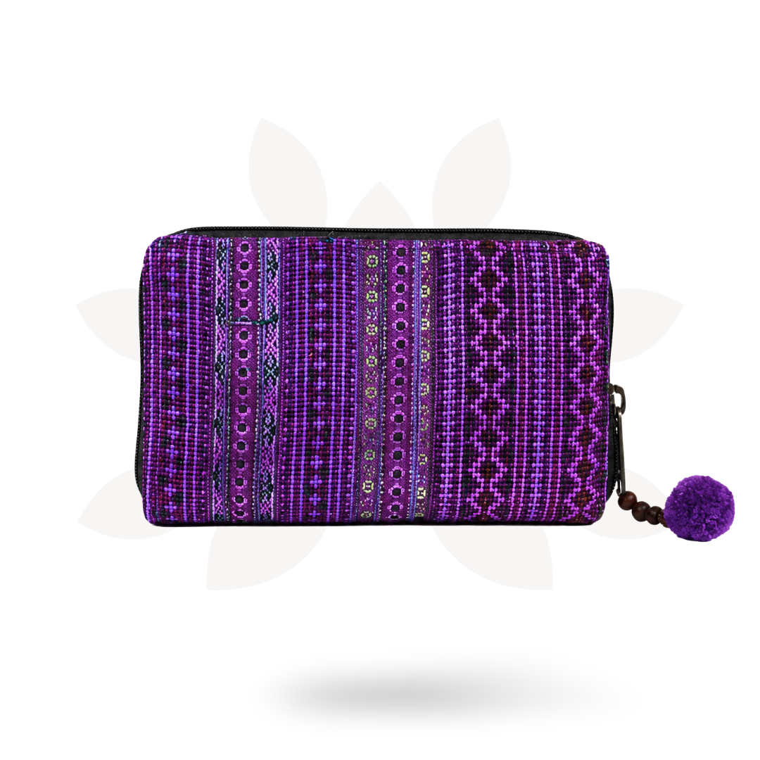Purple patterned pouch with a pom-pom on a white background