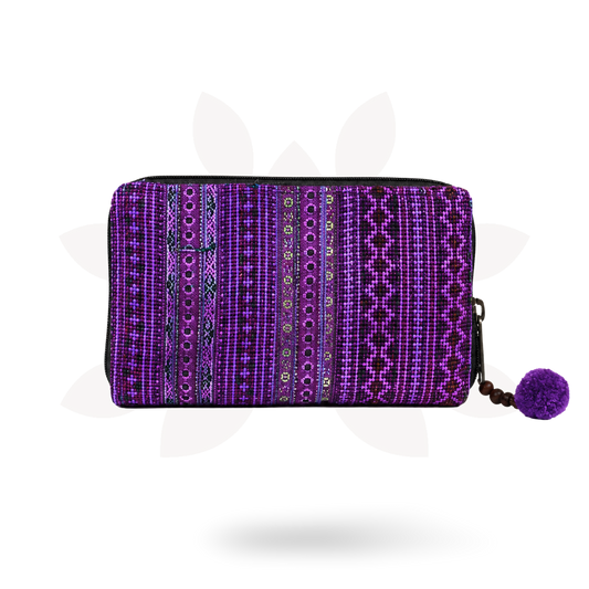 Purple patterned pouch with a pom-pom on a white background