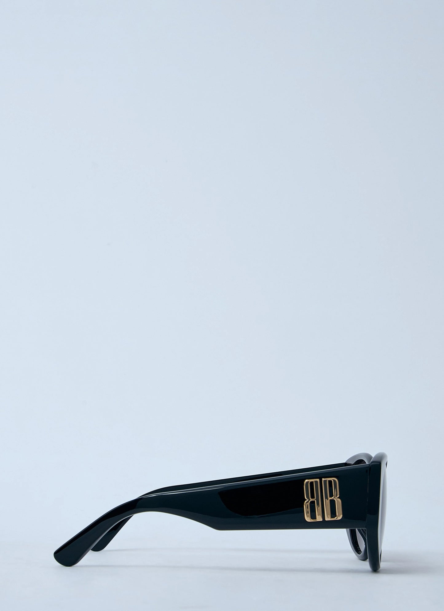 Black leather bag with a subtle pattern on a white background