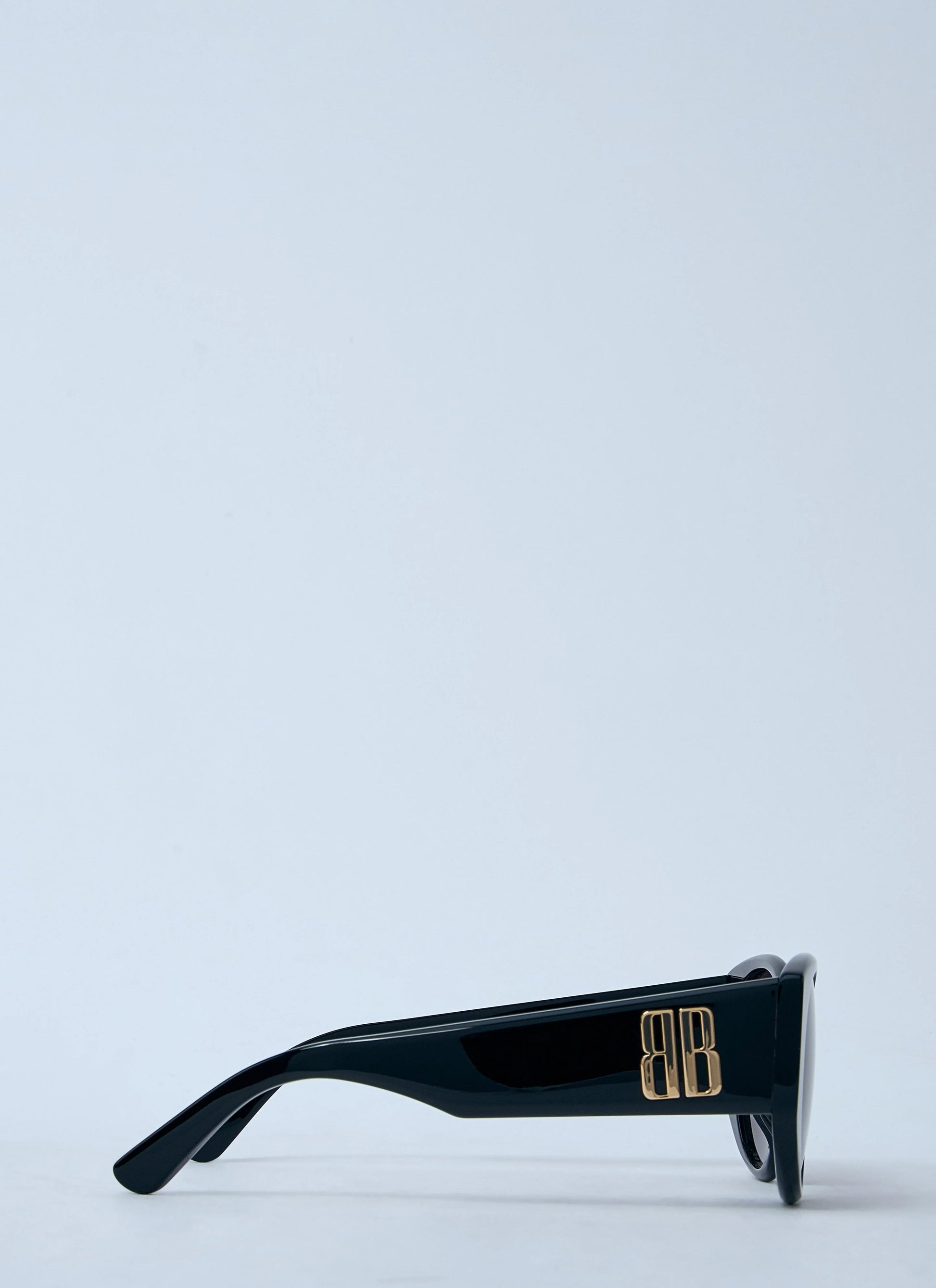 Black leather bag with a subtle pattern on a white background