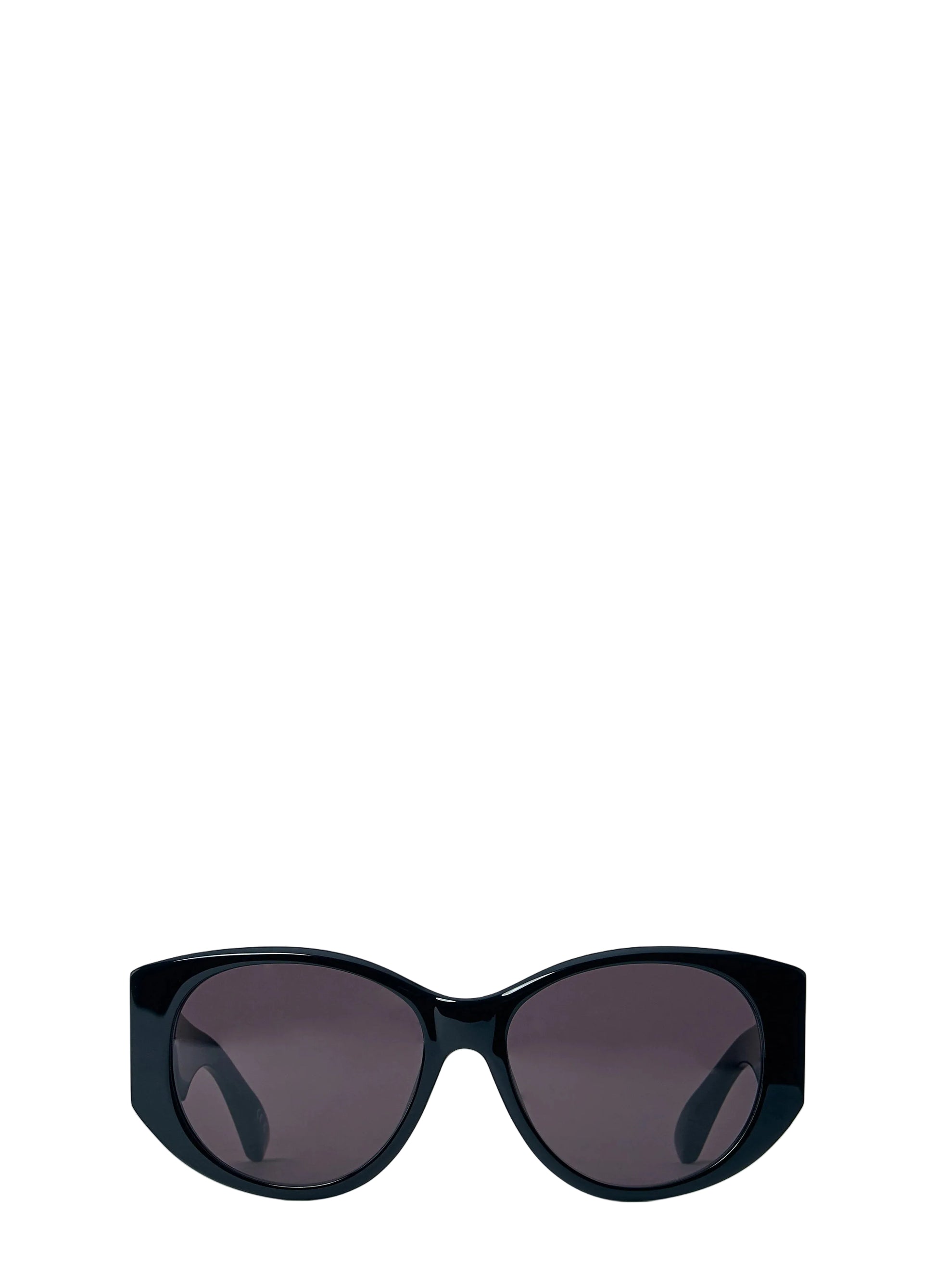 Black sunglasses with dark lenses on a light blue background