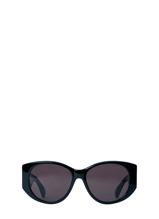 Black sunglasses with dark lenses on a light blue background