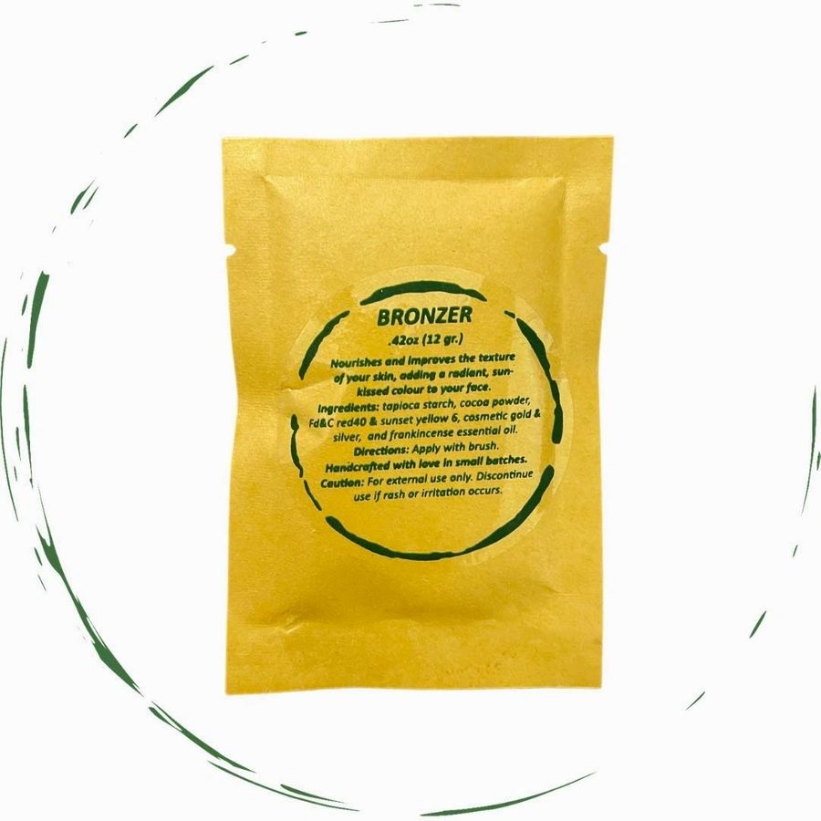 Yellow packet labeled 'Bronzer' on a white background