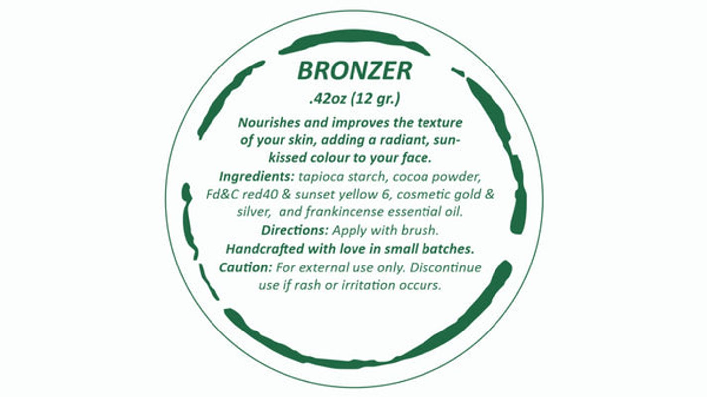 Round label for bronzer with text and ingredients on a white background