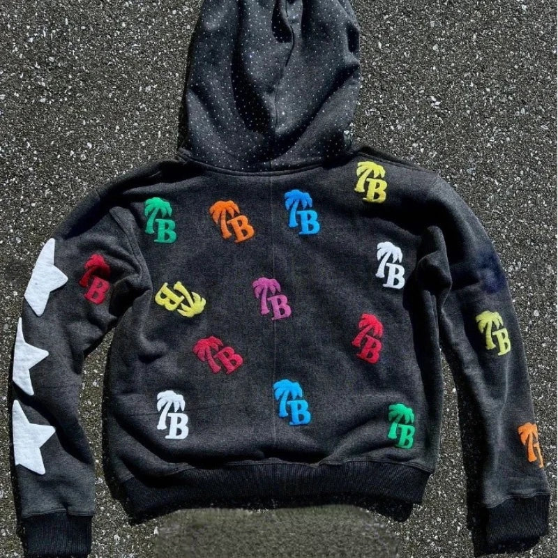 Black hoodie with colorful logos on a textured surface Black hoodie with colorful logos on a textured surface Black hoodie with colorful logos on a textured surface Black hoodie with colorful logos on a textured surface