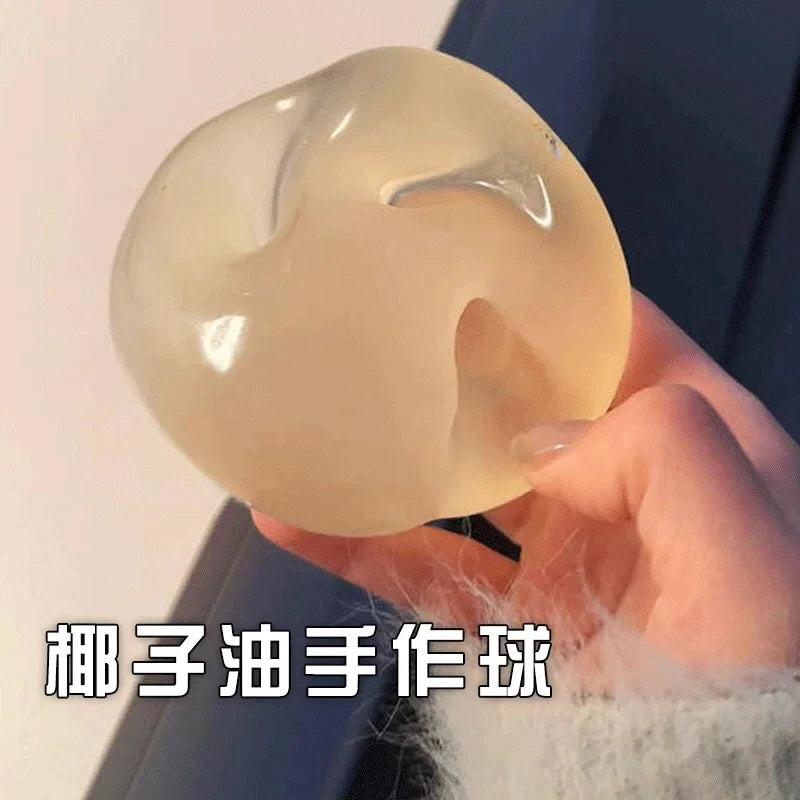 Blue translucent maltose squishy stress relief toy slowly rebounding in a hand, soft sensory fidget for anxiety relief, desk stress ball alternative and viral TikTok toy.